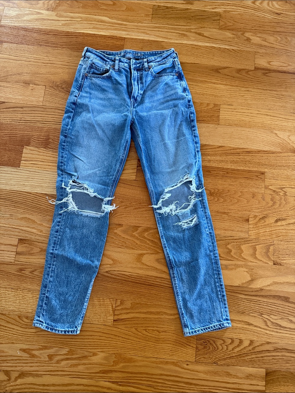 Distressed Light Blue Ripped Knee Jeans